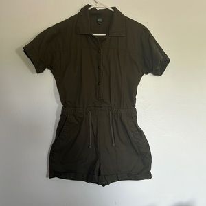 Here we have a dark green, x small, romper.